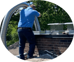 tech cleaning a chimney